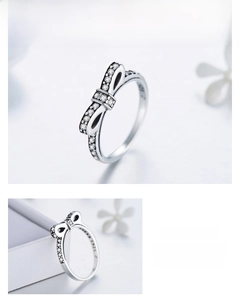 Macro detail of S925 sterling silver bow ring with micro-set sparkling zircon stones