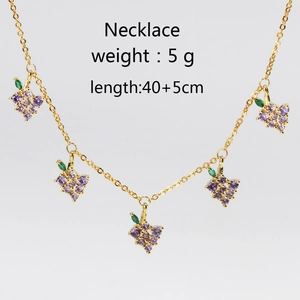 Golden necklace with five purple and green grape zircon pendants on white background