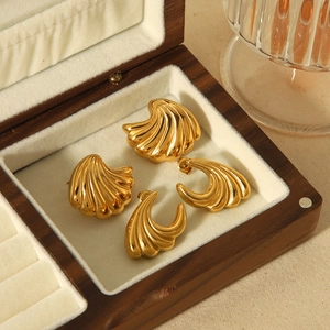 18k gold plated stainless steel wave earrings with shell texture on white velvet box