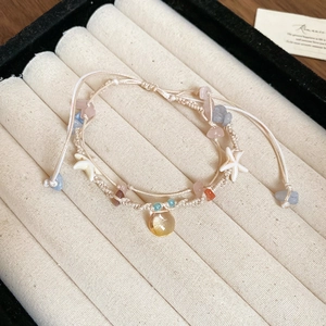 Boho-Armband mit weißem Seestern, bunten Steinen und Tropfenanhänger aus Naturstein