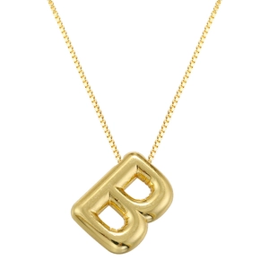 Macro shot of gold letter B balloon pendant necklace with high-gloss polished metal finish