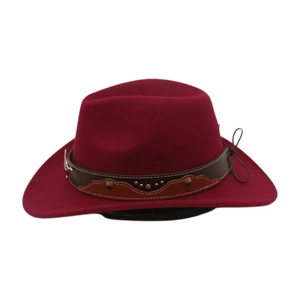 Detail of wine red felt cowboy hat with studded leather band and mountain patch decor