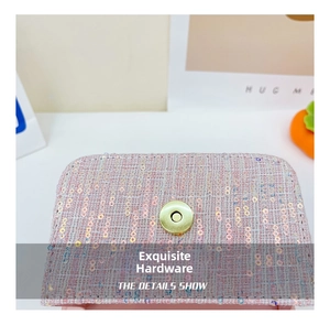 Macro view of pink tweed texture with sequins and a golden magnetic buckle for girls