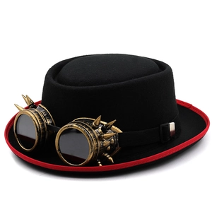 Black steampunk top hat with vintage gold goggles and red brim for cosplay events
