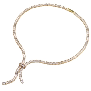 V-shaped gold necklace with zircon bowknot and pear-shaped tassel pendants on white background