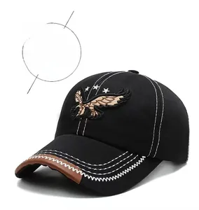 Close-up of eagle embroidery and white contrast stitching on black baseball cap