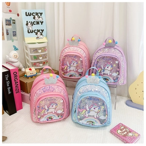 Four colorful sequin unicorn backpacks with glitter crowns and transparent front pockets
