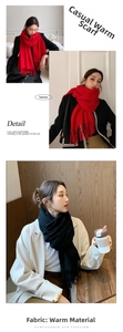 Detailed view of the soft fringe ends and knit texture of a solid red cashmere feel scarf