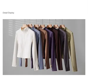 Slim fit zip-up yoga jackets in multiple colors displayed on elegant wooden hangers