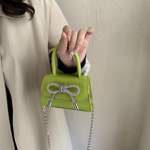 Mini avocado green shoulder bag with rhinestone bow and silver chain strap for women