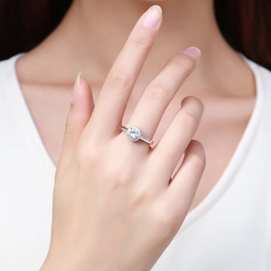 Sparkling S925 sterling silver halo ring with round zircon stones on a model's hand