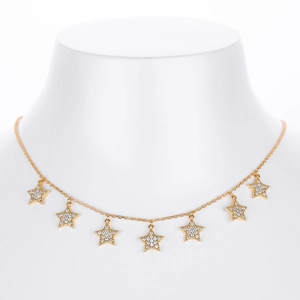 Detailed view of gold S925 necklace with seven sparkling cubic zirconia star pendants