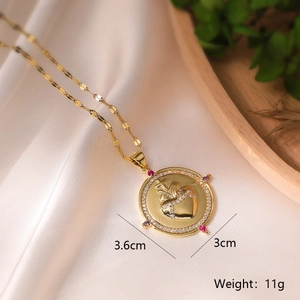 Detail showing 3.6cm gold angel cross pendant with zirconia and weight measurement