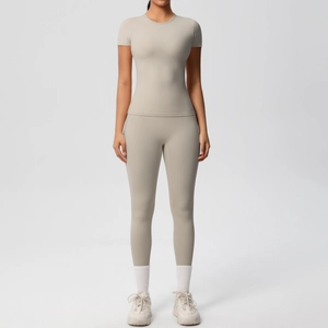 Front full view of two-piece seamless light grey workout set with top and leggings