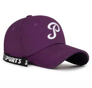 Detailed shot of purple baseball cap with 3D white P embroidery and sports woven ribbon