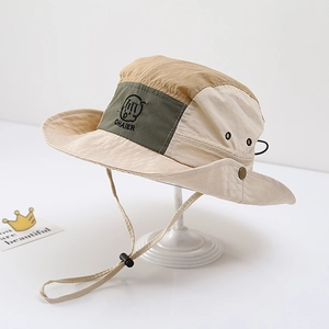 Detail of color-block sun hat with adjustable drawstring and metal ventilation eyelets