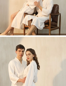 Detail of white waffle texture bathrobe showing absorbent fabric and comfy belted design