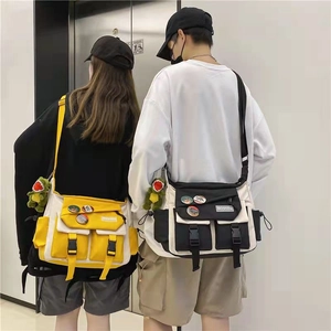 Canvas messenger bags in yellow and black, featuring multi-pockets and adjustable straps
