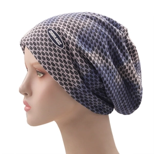 Detailed close-up of breathable mesh beanie featuring grey-blue honeycomb fabric and logo