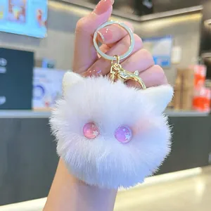 Cute white plush cat head keychain with sparkling pink eyes and golden metal clip