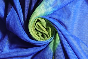 Macro detail of breathable blue and green gradient mesh fabric with fine net texture