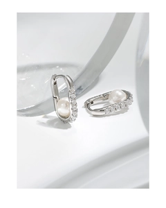 Detail of S925 sterling silver hoop earrings with oval zircon and white shell pearl