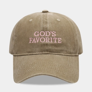Close-up of God's Favorite pink embroidery on a washed khaki cotton baseball cap