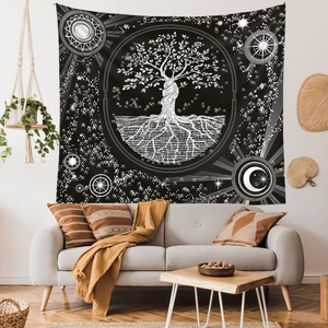 Detail of Tree of Life tapestry on wall featuring celestial sun moon and star motifs