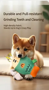 Close-up of a dog biting the squeaky fish plush toy with durable cotton rope detail