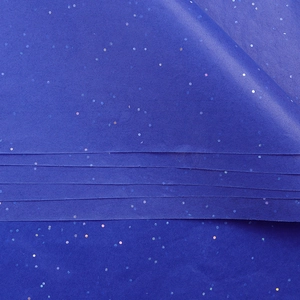Close-up of deep blue floral wrapping paper featuring sparkling laser sequins texture