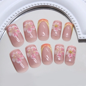 Ongles à presser avec fleurs en relief 3D et dégradé french orange vif