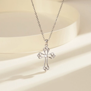 Detail of S925 sterling silver Celtic cross necklace with center cubic zirconia stone