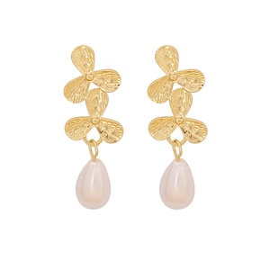 Elegant gold flower drop earrings with white teardrop pearls in a minimalist design
