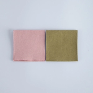 Pink and olive green velvet jewelry pouches with premium micro-suede texture detail