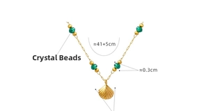 Detail of 18K gold-plated shell pendant with four green crystal beads on a thin chain