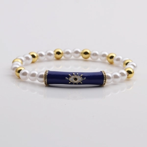 Elegant evil eye pearl bracelet with gold beads and blue enamel tube details