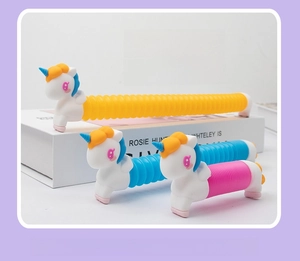 Unicorn pop tube toys in blue and pink showing size comparison before and after stretching