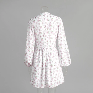 Close-up of white floral long sleeve dress with back invisible zipper and lantern sleeves