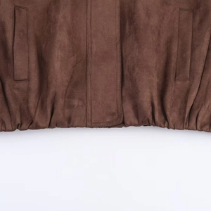 Brown suede-like jacket with ribbed hem and pocket detail in a minimalist aesthetic