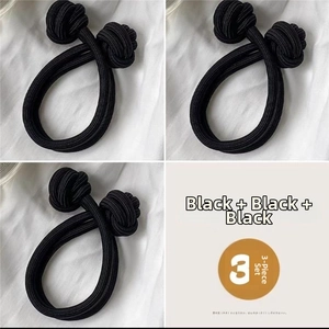 Detail of 3-piece set elastic black hair ties with durable thick knotted design