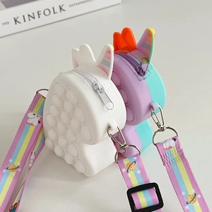 Detail view of unicorn pop-it silicone shoulder bags with colorful rainbow straps