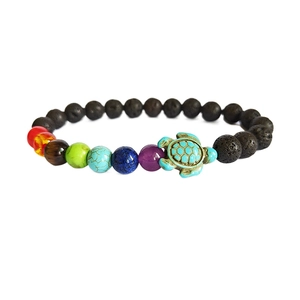 Matte black lava stone beads chakra bracelet with a turquoise turtle pendant charm