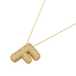 Detailed close-up of 18K gold-plated balloon letter F pendant with pavé zircon stones
