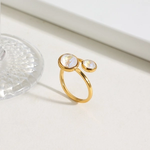 Detail of 18K gold-plated stainless steel open ring with two iridescent round stones