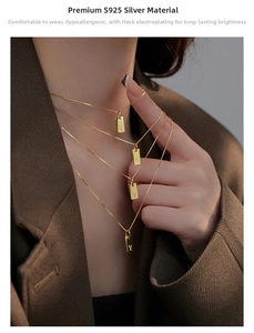 Detail of S925 silver gold-plated square plaque necklaces with initial pendants.