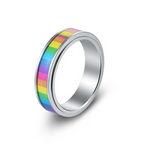 Detail of spinning stainless steel ring featuring a vibrant rainbow inlay and silver finish