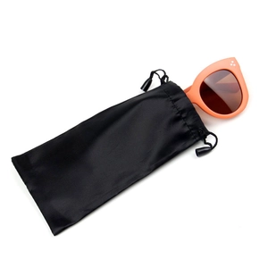 Orange cat-eye sunglasses with silver rivets and a black drawstring pouch set