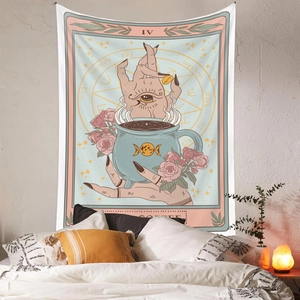 Detail of tarot style coffee tapestry with moon phases and mystic symbols on wall