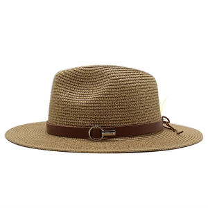 Close-up of woven straw fedora hat with brown leather band and silver metal buckle detail
