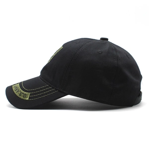 Detail of olive green U.S. ARMY embroidery on a black cotton twill baseball cap visor